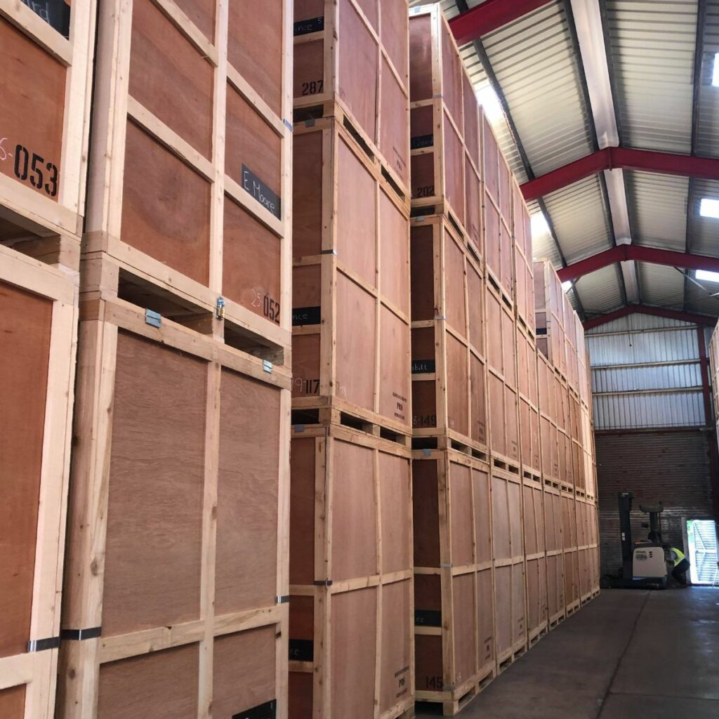Large wooden crates stacked in a self storage unit.