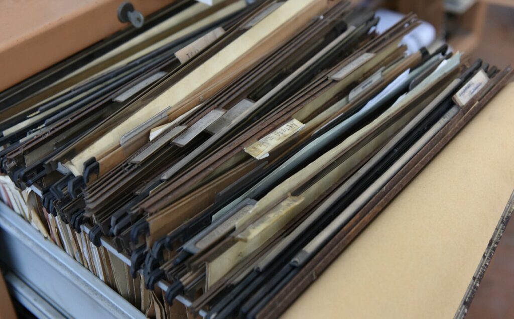 An open file drawer with labeled folders organized inside.
