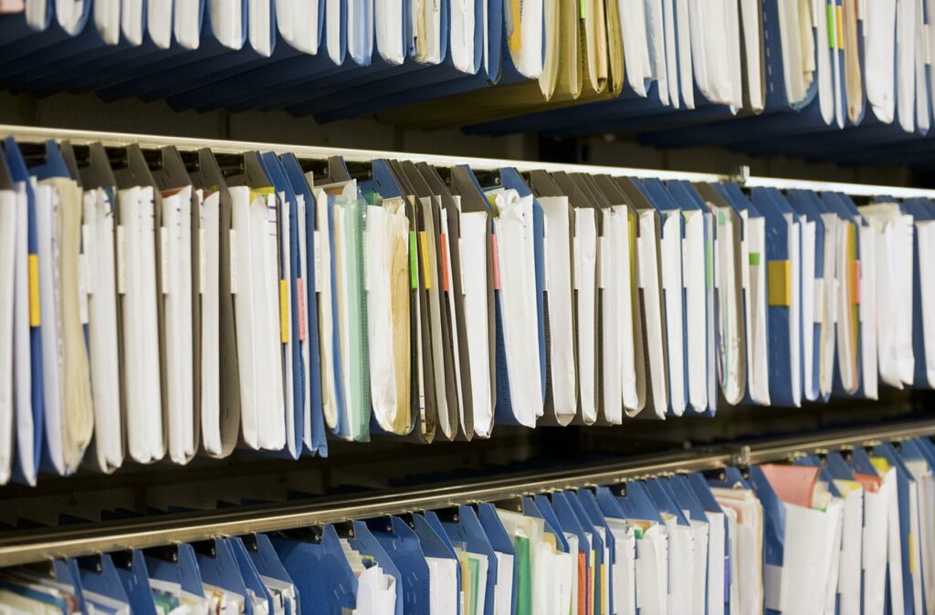 Shelves stocked with organized folders and files.